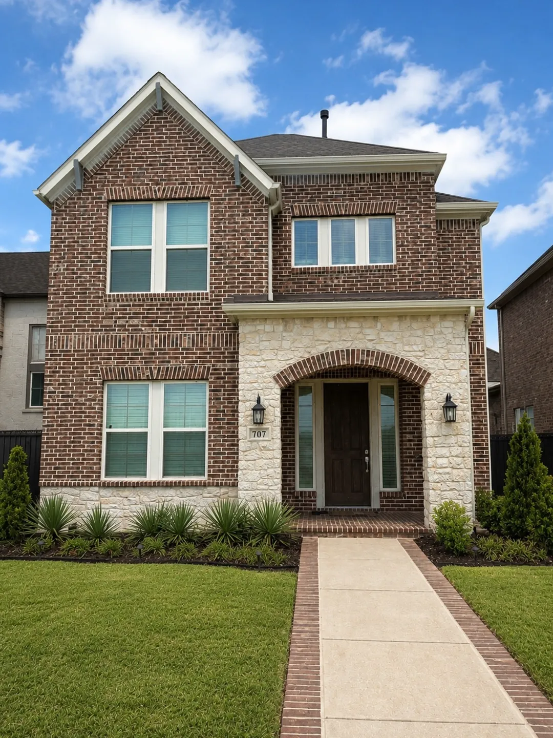 The same home in daylight, with no visible lighting hardware along the roofline